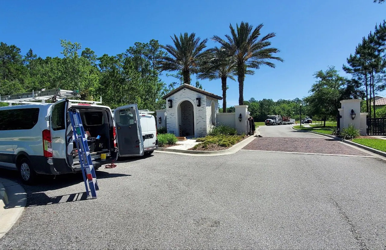 Service vans at the entrance of a gated community
