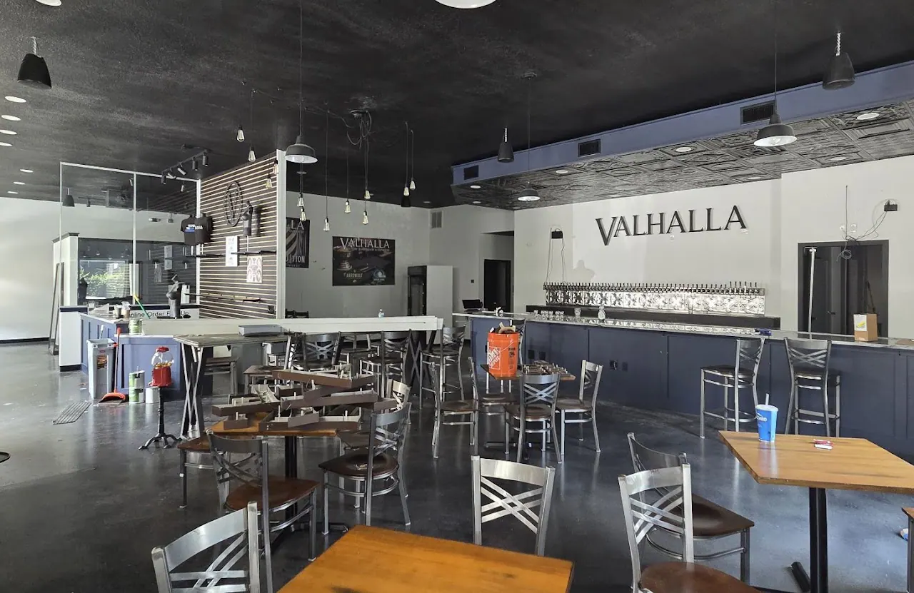Restaurant dining room with a bar and high tables